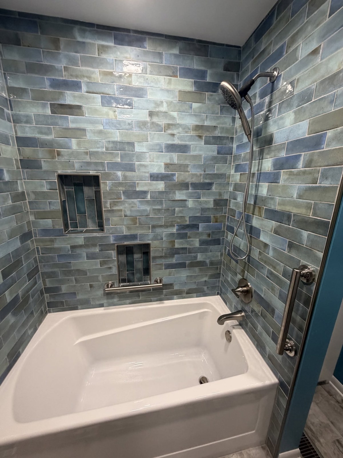 Bathroom renovation with blue-green glazed tile