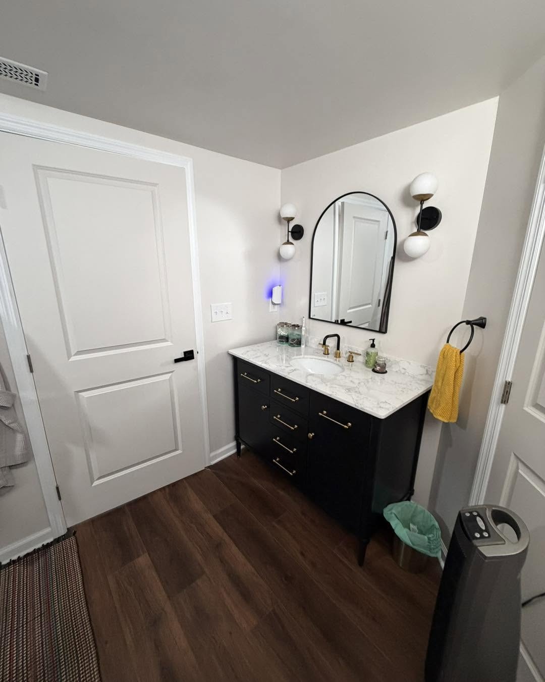 Bathroom vanity and tiled shower