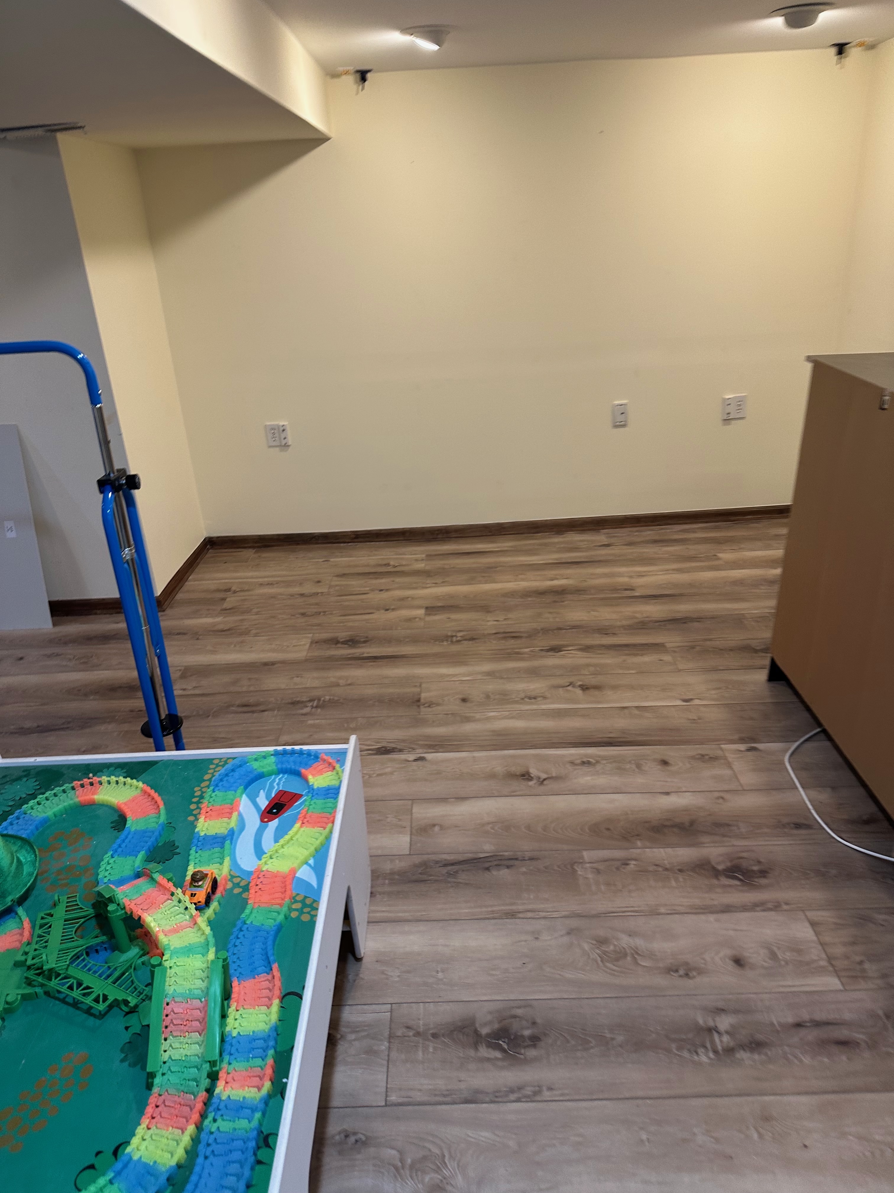 Plank flooring in an adjoining finished room