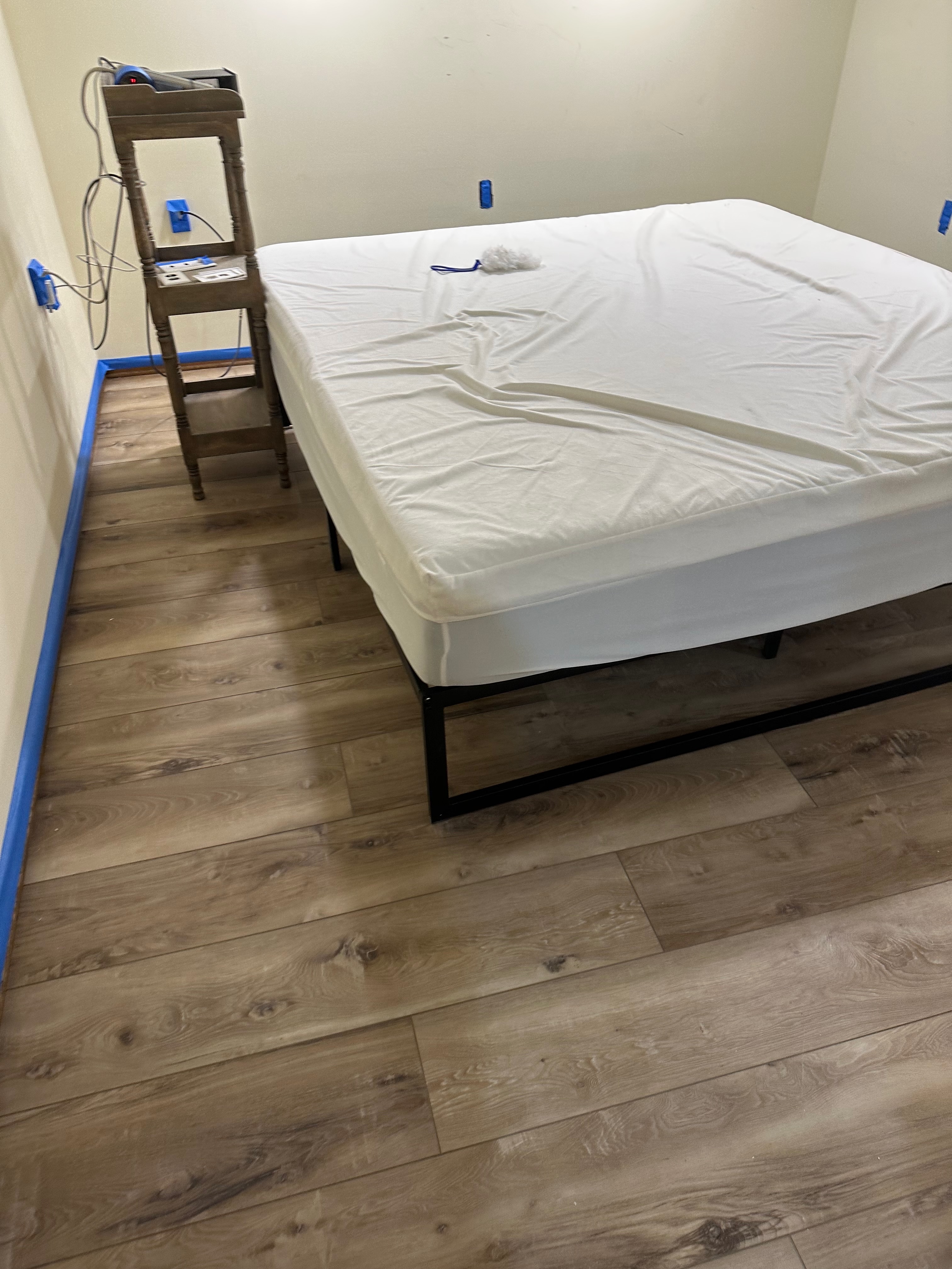 Plank flooring in a finished bedroom